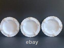 Set 8 Tiffany & Co. Plates by Royal Worcester, raised shell design, gold accent