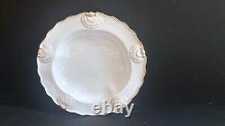 Set 8 Tiffany & Co. Plates by Royal Worcester, raised shell design, gold accent