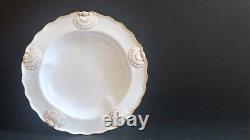 Set 8 Tiffany & Co. Plates by Royal Worcester, raised shell design, gold accent