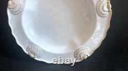 Set 8 Tiffany & Co. Plates by Royal Worcester, raised shell design, gold accent