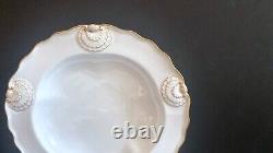 Set 8 Tiffany & Co. Plates by Royal Worcester, raised shell design, gold accent