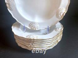 Set 8 Tiffany & Co. Plates by Royal Worcester, raised shell design, gold accent