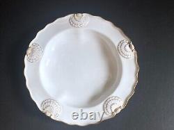 Set 8 Tiffany & Co. Plates by Royal Worcester, raised shell design, gold accent