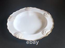 Set 8 Tiffany & Co. Plates by Royal Worcester, raised shell design, gold accent