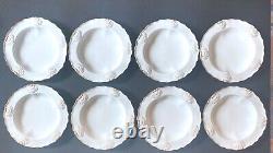 Set 8 Tiffany & Co. Plates by Royal Worcester, raised shell design, gold accent